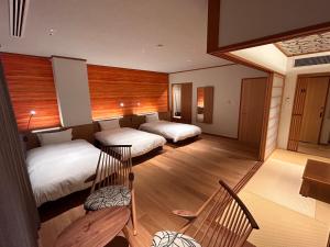 Voodi või voodid majutusasutuse Kintarou Onsen Hotel toas