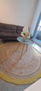 a coffee table in a living room with a couch at Montenegro 2 dormitorios in Temuco