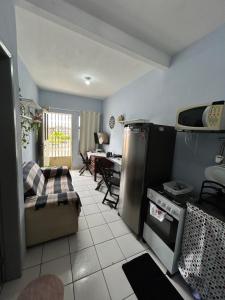 a living room with a refrigerator and a table at Betesda 2197 D in São Luís