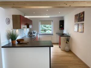 a kitchen with a large island in a room at Apartment Annemarie 4 in Meersburg