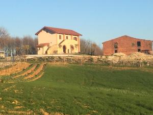 a house on top of a green field with a building at Agriturismo Montebeltrano in Paterno Calabro +21 photos