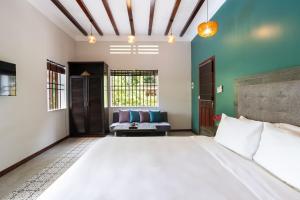 Postel nebo postele na pokoji v ubytování Serene Beach Hoian