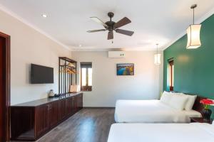 Postel nebo postele na pokoji v ubytování Serene Beach Hoian