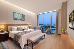 Katil atau katil-katil dalam bilik di Somerset QPlex Shenzhen