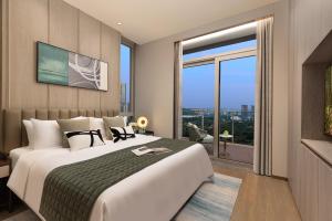 Katil atau katil-katil dalam bilik di Somerset QPlex Shenzhen