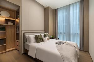 Katil atau katil-katil dalam bilik di Somerset QPlex Shenzhen