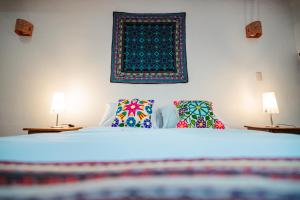 Postel nebo postele na pokoji v ubytování Picaflor Tambo Guest House