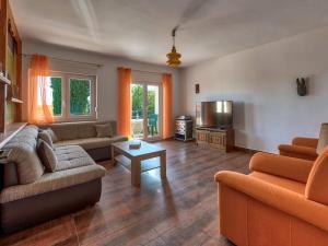 a living room with two couches and a tv at Dante Medulin Comfortable holiday residence in Medulin