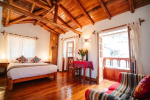Voodi või voodid majutusasutuse Picaflor Tambo Guest House toas