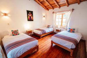 Postel nebo postele na pokoji v ubytování Picaflor Tambo Guest House