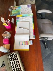 a desk with a keyboard and a remote control at Hermoso departamento con vista al mar y privado in La Playita +10 photos