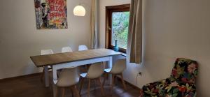 a room with a table and chairs and a window at Waldseele Appartement in Battenberg