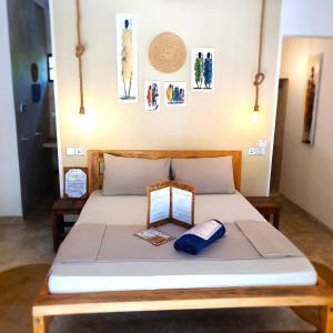 Postel nebo postele na pokoji v ubytování Michamvi Spirit Lodge