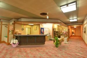 a waiting area in a hospital with a waiting room at Senso Yutagawa in Tsuruoka