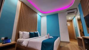 Ein Bett oder Betten in einem Zimmer der Unterkunft ABISHA Hotel Sanur