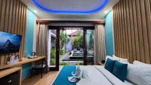 Ein Bett oder Betten in einem Zimmer der Unterkunft ABISHA Hotel Sanur