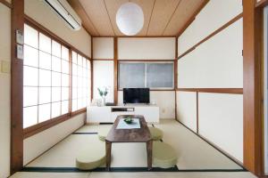 an office with a table and chairs in a room at Machiya 京 Asakusa in Tokyo