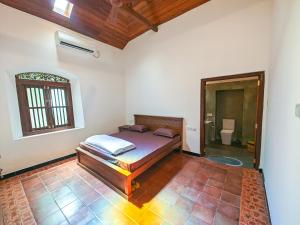 Postel nebo postele na pokoji v ubytování Newlands Bungalow Galle