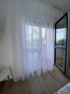 Posteľ alebo postele v izbe v ubytovaní Apartman Emilija