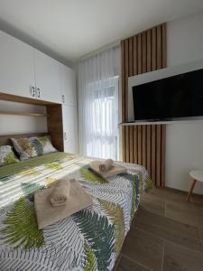 Posteľ alebo postele v izbe v ubytovaní Apartman Emilija