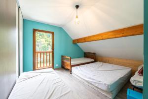 Postel nebo postele na pokoji v ubytování Le Revers