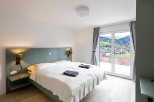 Posteľ alebo postele v izbe v ubytovaní Panorama Appartement + 37 fotografií