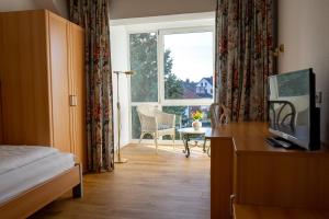 Ein Bett oder Betten in einem Zimmer der Unterkunft Hotel Klusenhof