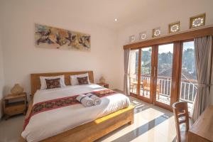 Ένα ή περισσότερα κρεβάτια σε δωμάτιο στο Midep Home Stay