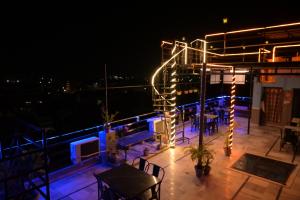 a patio with lights on the roof at night at MOON NIGHT GUEST HOUSE in Jodhpur