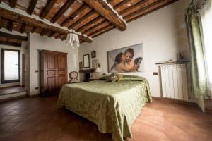 Postel nebo postele na pokoji v ubytování Agriturismo Il Caggio