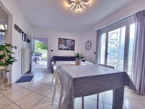 a dining room with a table and chairs in a room at Casa Le Vignole - Aosta in Aosta