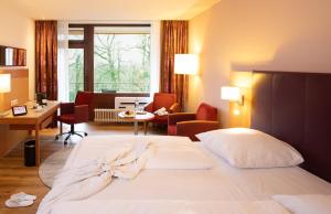 Postel nebo postele na pokoji v ubytování Dolce by Wyndham Bad Nauheim