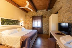 Postel nebo postele na pokoji v ubytování I Tre Poggi Dimora di Charme + 37 fotografií