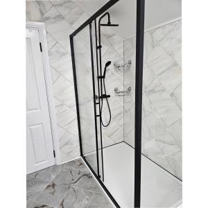 a shower with a glass door in a bathroom at Newly Renovated 2 Bed with Garden & Parking in Ipswich