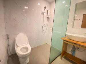 a bathroom with a toilet and a sink at A Plus Deluxe Hotel in Ko Lipe