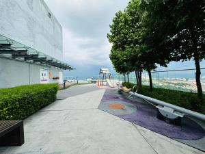 a view of a building with a playground with a telescope at Eko Cheras Duplex by DeUrban in Kuala Lumpur