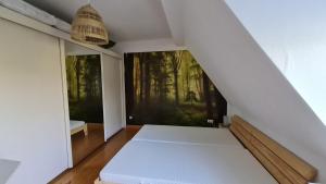 a bedroom with a bed and two large windows at Ferienwohnung Ollywood Hill in Halbs