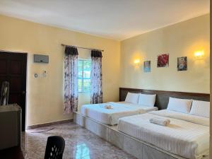 Postel nebo postele na pokoji v ubytování DVilla Guesthouse Langkawi + 37 fotografií
