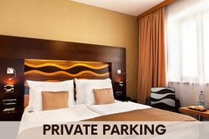 Postel nebo postele na pokoji v ubytování Danubia Gate Hotel