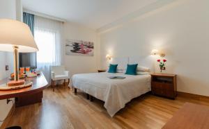 Letto o letti in una camera di Hotel Vigna