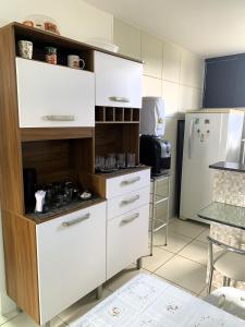 Kuchyň nebo kuchyňský kout v ubytování Maragogi Flat Residence