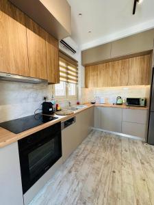Kuchyň nebo kuchyňský kout v ubytování Ionion Apartment
