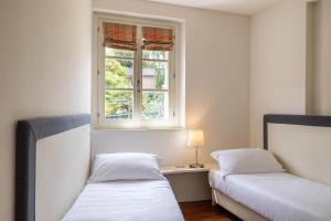Postel nebo postele na pokoji v ubytování Resort Antico Verbano