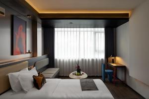 Katil atau katil-katil dalam bilik di Bil比尔行旅酒店天河客运站广州东站店 +65 gambar