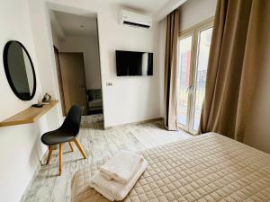 Postel nebo postele na pokoji v ubytování Ionion Apartment