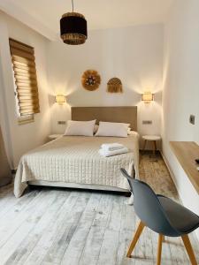 Postel nebo postele na pokoji v ubytování Ionion Apartment