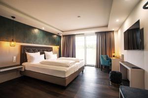 Postel nebo postele na pokoji v ubytování Villaggio Hotel + 37 fotografií
