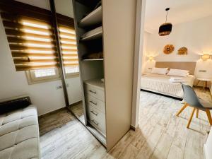 Postel nebo postele na pokoji v ubytování Ionion Apartment