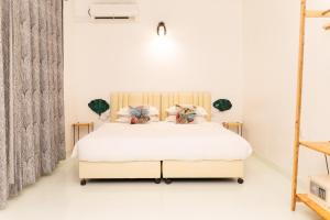 Postel nebo postele na pokoji v ubytování Fasdheythere Inn Maldives