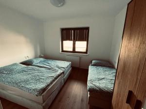 Postel nebo postele na pokoji v ubytování Apartament w Dolinie Sanu